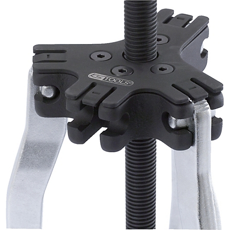 Ein schwarzer KFZ-Abzieher, zentral eine Gewindestange, darauf ein schwarzer, sternförmiger Halter mit Krallen und silbernen Hebeln.